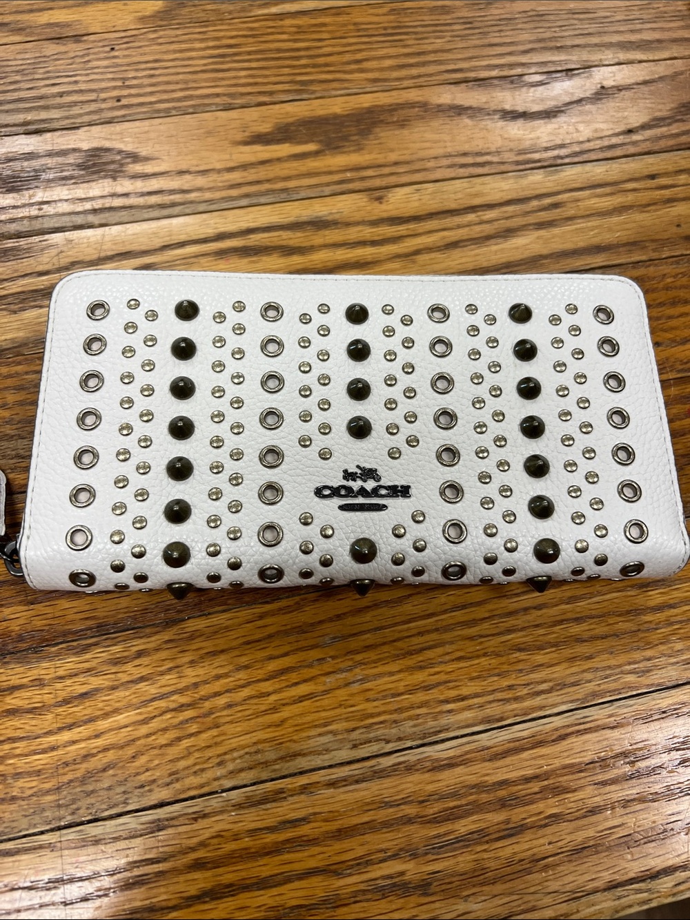 COACH | All Over Studs & Grommets zip around pebbled leather accordion wallet